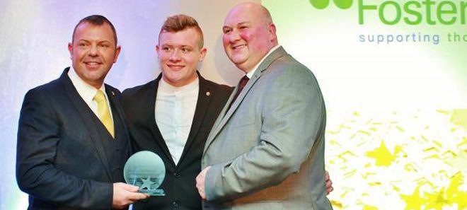 Mark, Nick and their foster child, Luke, at the Fostertalk Awards ceremony in 2014.
