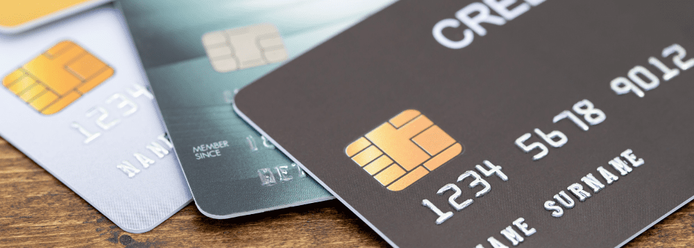A pile of credit cards illustrate the need for money saving tips for families.