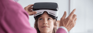 Picture: a child using a virtual reality headset.