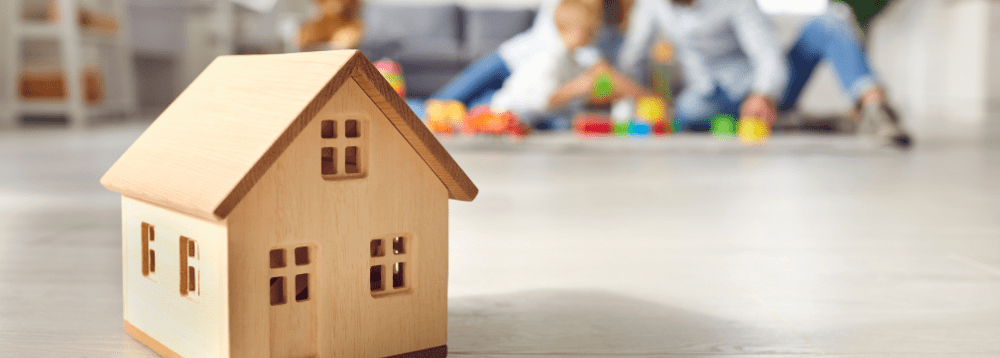 A wooden model of a family house.