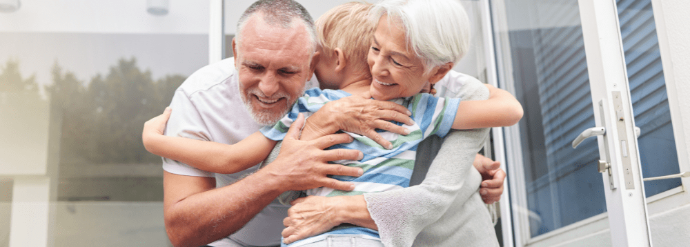 elderly couple happily working after retirement as foster carers.